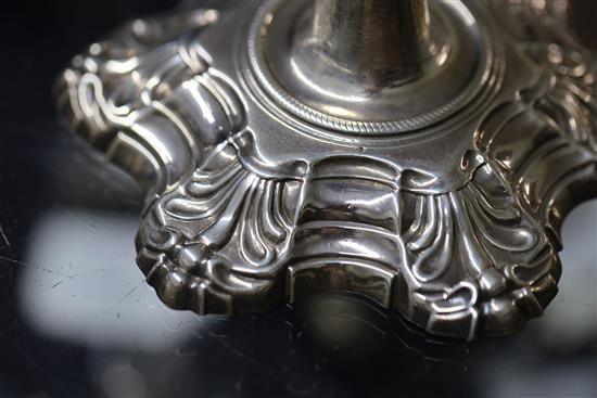 A set of four George II cast silver candlesticks by John Cafe, 73.5 oz.